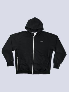 ✤ Vintage Item ✈ Ships worldwide from Bratislava, Slovakia ✂ Materials: cotton, embroidery  Size: XL Condition: 10/10  Elevate your sporty wardrobe with this sleek Nike Standard Zip-up hoodie in size XL. Engineered with Dri-FIT technology, it promises to deliver classic style coupled with modern performance. The black hue and minimalist design make it a versatile piece for both active and casual outings. Made in Vietnam, it ensures comfort and durability. Don't miss out on this athletic staple! Functional Cotton Hoodie For Streetwear, Functional Streetwear Sweatshirt With Ribbed Cuffs, Functional Crew Neck Hoodie For Streetwear, Functional Black Sweatshirt For Streetwear, Functional Sweatshirt For Streetwear With Ribbed Cuffs, Cotton Athleisure Track Jacket For Streetwear, Functional Sweatshirt With Ribbed Cuffs For Streetwear, Functional Hooded Streetwear Tops, Functional Hooded Tops For Streetwear