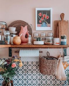 a shelf filled with lots of dishes and vases