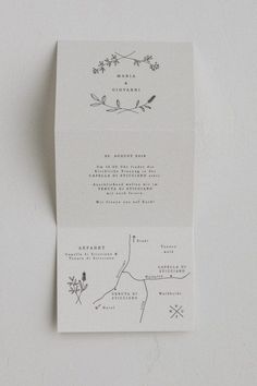 the wedding stationery is printed on white paper