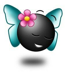 a black ball with a pink flower on it's head and eyes are smiling