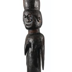 a wooden statue with a cat on it's head and legs, standing in front of a white background