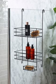 a bathroom shelf with soap, lotion and other items hanging from it's sides