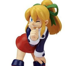 a figurine of a girl pointing her finger at the camera