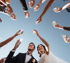 a group of people holding wine glasses in the air