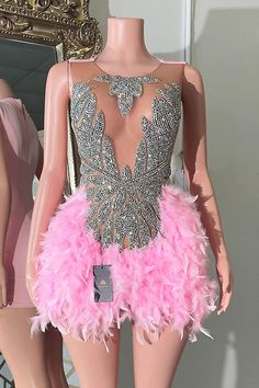 This Flori Rhinestone Dress is crafted with luxurious mesh and embellished with glistening rhinestones and delicate pink feathers. Its mini style and eye-catching color make it an ideal choice for special occasions such as prom, birthdays, date nights, and weddings. With its exquisite craftsmanship, this dress exudes sophistication and class, offering an unforgettable look for any event. Feather Skirt, Sheer Mini Dress, Glamorous Party, Prom Dress Shopping, Illusion Neckline, Pink Feathers, Date Nights, Rhinestone Dress, Nature Inspired Design