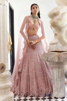 Blush pink attached can-can lehenga with all over scallop embroidery in pearls, crystals, thread and sequin work. Paired with a padded blouse with all over crystal and pearl embroidery. Comes along with a scallop trimmed dupatta with pearls, sequin and crystal embroidered border.
Components: 3
Pattern: Embroidery, Embellished
Type Of Work: Pearls, Crystals, Sequin, Thread
Neckline: Sweetheart Neck
Sleeve Type: Sleeveless
Fabric: Organza
Color: Pink
Other Details: 
Model height: 5 ft 7 inches, we Pearl Lehenga, Scallop Embroidery, Embroidery Pearls, Ridhima Bhasin, Seema Gujral, Desi Fits, Blouse Tops Designs, Organza Embroidery, Organza Lehenga