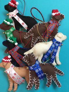 a bunch of ornaments that are sitting on a blue tablecloth with one horse and the other dog