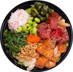 a black plate topped with lots of different types of sushi and other food items