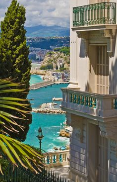 the balconys and balconies on this building overlook the blue water in monaco