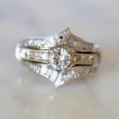 a close up of two rings with diamonds on them