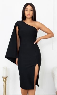 a woman wearing a black one shoulder dress with thigh high slits and an asymmetric