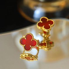 CLOVER MEDIUM GOLD CARNELIAN STUD EARRINGS Luxury Red Earrings For Formal Occasions, Elegant Red 14k Gold Jewelry, High-end Gold Earrings For Gift, Elegant Red Hallmarked Earrings, Designer 14k Gold Earrings Gift, Designer Red Earrings For Gifts, Designer Red Earrings For Formal Occasions, Aaa Quality Red Jewelry For Formal Occasions, Luxury Gold-plated Gemstone Earrings