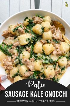 sausage kale gnocchi with spinach in a white bowl on a table