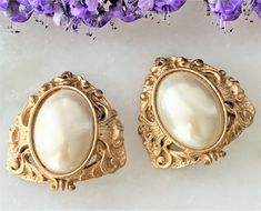 "Victorian Etruscan Style Antique Gold Tone Open Work Clip On Earrings with Large Oval Imitation Pearl Cabochons Earrings Measure 1 3/8\" Long x 1 3/8\" Wide Earrings are Slightly Domed Engraved Open Work Antique Gold Tone Metal Large Oval Imitation Pearl Cabochons are Natural Color and Measure 1\" Long x 5/8\" Wide Clip On Earrings Made in USA COMPLIMENTARY DOMESTIC SHIPPING" Fabric Headbands, Gold Pearl, Gold Tone Metal, Pearl Bracelet, New Vintage, Black Diamond, Antique Gold, Clip On, Natural Color