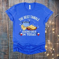 "The \"Best Tamale Making Crew In Texas.\"  This traditional Mexican illustration graphic tee of tamlaes being prepared for Christmas is sure to be a hit!  Tamale season is back, you have waited all year, now celebrate with this t-shirt.  A Christmas holiday favorite food, here you have a cute festive design mixed with corn husk, the traditional pot, and of course, for you proud Texans the Texas flag, this shirt is the perfect gift for your tamale crew and will be perfect for your  tamale crew t Mexican Illustration, Tamale Party, Mexican Tamales, Cricut Shirts, Mexican Shirts, Texas Flag, Texas Flags, Corn Husk, Traditional Mexican