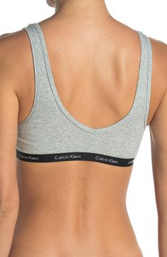 A lightly ribbed fabric creates ultimate comfort on this brand detailed banded bralette. Banded straps V-neck All-over ribbed construction 55% cotton, 35% polyester, 8% elastane Machine wash cold, tumble dry low Imported Calvin Klein Spring Tops For Everyday Wear, Trendy Cotton Bra For Loungewear, Ribbed Fitted Bra, Calvin Klein Spring Everyday Tops, Calvin Klein Seamless Spring Bra, Calvin Klein Medium Support Seamless Sports Bra, Calvin Klein Seamless Sports Bra With Medium Support, Calvin Klein Stretch Seamless Sports Bra, Ribbed Fabric