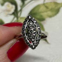 A vintage sterling silver marcasite ring for a woman. Art Deco marcasite ring in silver set with marcasite stones. A gift that would suit both the vintage hunter and the jewellery lover. This statement ring is a marquise shape and would make a unique gift for yourself, wife, partner, girlfriend, sister or Mum. The Art Deco style is timeless.  The ring is simply stamped 'silver' inside the shank.  Approximate measurements  Ring size: UK & AUS-M 1/2 Ring Size: US 6 / 61/2 What is marcasite? - Marc Marcasite Ring, Sterling Silver Marcasite, Statement Ring Silver, Gift For Wife, Multi Stone Ring, Vintage Ring, Ring Vintage, Ring For Women, Jewelry Lover