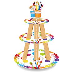 three tiered tray with paintbrushes and paints on the bottom, one is multicolored