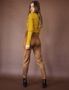 Our KITE pants are leggings made out of textured vegan suede. They are stretchy and thick, have an elastic waistline for easy sizing and a a side invisible zipper with a little hook attachment. Runs true to size. Has a good amount of stretch. S= 0-4; M= 6-8; L= 10-12 Model is 5'6 wearing size S. FABRIC & CARE This is a cruelty free piece made carefully and ethically for Blue District, preserve its life by reading and following the tag guidelines. Tip: When in doubt, air dry your garment! It Eden Dress, Undershirt Tank Top, Denim Cargo Pants, Facebook Style, Pink Out, Gold Wrap, Stay In Shape, 80 Dress, 70 Dress