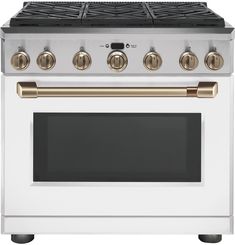 a white and gold stove top oven with two burners on the front, and four burners on the back