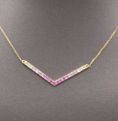 "Ombre Pink Sapphire V Station Necklace in 14k Yellow Gold This lovely sparking petite necklace features every shade of pink a girl could want!  The sapphires are natural earth mined stones and total 0.30cttw.  The  cable chain necklace features a C ring clasp and has rings at 16\", 17\" and 18\" so that you can adjust it for a custom fit.  The necklace is made in 14k yellow gold and weighs 1.70g." Fine Jewelry Pink Multi-stone Necklace, C Ring, Petite Necklace, Ombre Pink, Cable Chain Necklace, Station Necklace, Pink Ombre, Natural Earth, Pink Sapphire