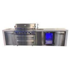 an outdoor kitchen with stainless steel appliances and blue lights on the oven door is shown