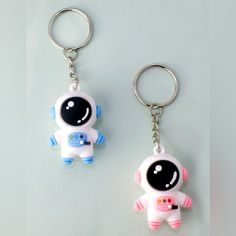 two key chains that have been shaped to look like an astronaut