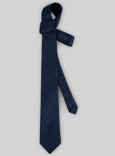 It's not just wedding and work guys are getting dressed up for these days, making a stylish selection of tailoring accessories essential for every man's wardrobe. 
 
 This tie would compliment your suits or blazers and will stand out with it's solid finish. 
 
 A must have for your neckwear collection that you won't find anywhere else. 
 
 Width at widest : 2.75 inches. Tailoring Accessories, Getting Dressed, Men's Wardrobe, Blue Satin, Get Dressed, Must Haves, Dress Up, Satin, Blazer