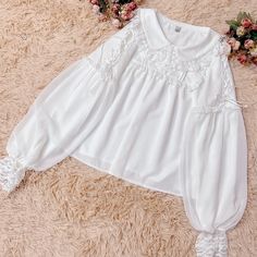 This price is for a blouse only.   	 		 			Size 			S 			M 			L 			XL 		 		 			Shoulders 			36 			37 			38 			39 		 		 			Bust 			90 			94 			98 			102 		 		 			Sleeve Length 			60 			61 			62 			63 		 		 			Full Length 			57 			58 			59 			60 Spring Tops With Lace Doll Collar, Spring Top With Lace Doll Collar, Spring Tops With Lace And Doll Collar, White Collared Feminine Blouse, White Blouse With Peter Pan Collar For Spring, Feminine Puff Sleeve Top With Lace Collar, Long Sleeve Top With Lace Collar For Summer, Feminine Tops With Lace Doll Collar, White Tops With Cute Collar In Feminine Style