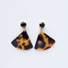 Wear these fashion earrings day or night, spring or fall. Treat the tortoise shell pattern as a neutral and wear it with everything from denim to a little black dress.  Season to Wear: Spring, Summer, Fall, Winter -Matte Black stones and Acrylic Elements -Lightweight, Nickel Free, Hypoallergenic -Length: 1.6" Width: 1.5" Weight: 0.20 oz Jewelry Care: You can maintain the sparkle and shine of your TrendingAbove jewelry by avoiding direct contact with water, chemicals, perfume, lotions and sprays. Elements Jewelry, Vacation Jewelry, Earrings Beach, Jewelry Summer, Black Stones, Shell Pattern, Dress Designer, Summer Styles, Trendy Earrings