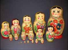 an assortment of colorful nesting dolls sitting next to each other