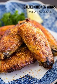 grilled chicken wings on a blue and white plate