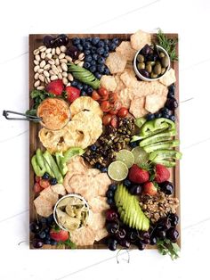 a wooden platter filled with different types of food