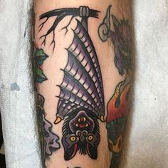 a man's leg with a tattoo on it and an image of a bird