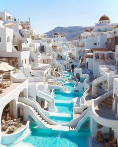 an outdoor swimming pool with water slides and lounge chairs on the side, surrounded by white buildings