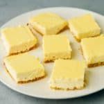 several pieces of yellow cake on a white plate