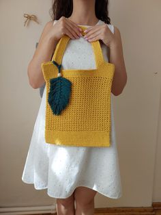 - This crocheted high quality tote bag is totally handmade - It is a perfect accessory for halloween. *Custom orders are welcome.  *In stock and ready to ship. *All the orders are shipped with EXPRESS courier and tracking number.  Size :     - Width : 28cm /11"     - Length : 35cm /13.77 "     - With Strap  : 50cm /19.68 "  Materials :     - 55% Cotton    - 45% Acrylic    - Yarn Strap    Care Instructions :    - Hand wash gently in cool or lukewarm water and lay flat to dry. * Please keep in min Yellow Tote Bag, Autumn Gifts, Shoulder Purse, Acrylic Yarn, Purses And Handbags, Handmade Natural, High Quality, Yarn, Shoulder Bag