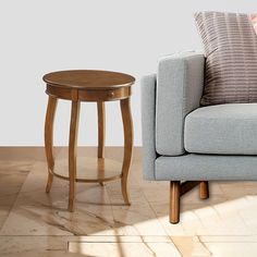 a living room scene with focus on the sofa and side table in the foreground