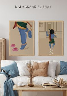 two paintings hang on the wall above a white couch in a living room with pillows