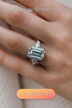 a woman's hand with an engagement ring on it and the words explore more below