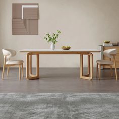 a dining table with two chairs and a vase on the table in front of it