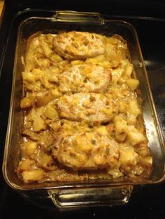 a casserole dish with chicken, potatoes and gravy