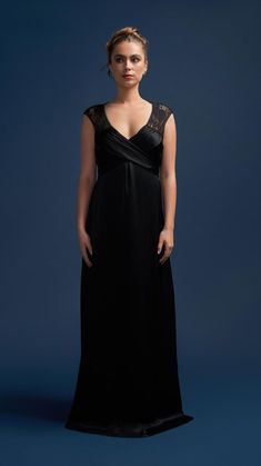 Experience the allure of the Victoria Vacationing full-length gown in timeless black. This sophisticated dress is designed to make a statement with its dramatic lace back and shoulder panels, adorned with feature ties that wrap from the front under the bust to the back for a flawless fit. The feminine sweeping skirt adds a touch of elegance, while delicate lace detailing completes the look for those unforgettable after-dark moments.  A deep plunge neckline to suit all bust sizes, ensuring a flat Dark Moments, Full Length Gowns, Sophisticated Dress, Victoria Dress, Floor Length Dresses, Lace Back, Lace Design, Independent Designers Fashion, Modern Woman