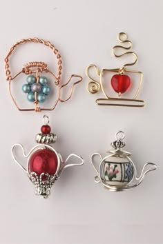 four different types of brooches are shown in three different colors and designs, one is red, the other blue