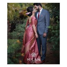 a man and woman standing next to each other in front of trees with the caption millan design