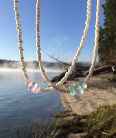 "White chokers with a sea glass middle! D E T A I L S This choker is made on a flexible wire for added comfort and durability. The closure is a lobster clasp. There is an extension chain so you can wear it to fit wherever you want on your neck. S I Z I N G This choker is approximately 14\" with a 2.5\" extension chain. If you would like a different size, please read below! How to request a different length: 1. Add this listing to your cart ($1 per item that you would like a different size for): Summer Choker, Rainbow Choker, White Choker, Popular Necklaces, Beach Necklace, Bead Choker, Beach Necklaces, Boho Choker, Rainbow Beads