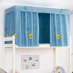 a child's room with a bunk bed and blue curtains