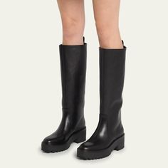 Loeffler Randall "Carlee" smooth calf leather tall moto boots 2.25 in / 55 mm block heel; 1.00 in / 25 mm platform Round toe Pull-on style Pull tab at collar Lugged rubber outsole Lining: Goat leather Professional cleaning recommended Imported