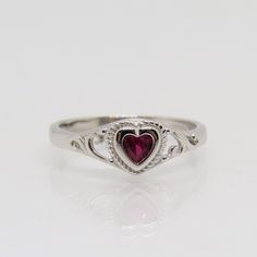 Sterling Silver Ruby Heart Filigree Ring ...Marked 925...Total of weights 1.7grams...Size 7...Measure of Face 6.6MM...It's in very good condition. Ruby Ring Silver, Silver Vintage Heart Promise Ring, Vintage Silver Ruby Ring, Vintage Silver Heart Cut Rings, Silver Heart-shaped Ruby Ring, Sterling Silver Heart-shaped Ruby Ring, Cute Engagement Rings, Ruby Jewelry, Filigree Ring