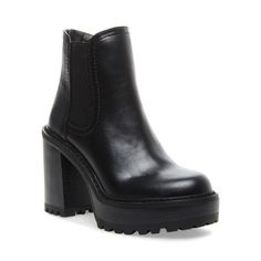 a black ankle high boot with chunky soles